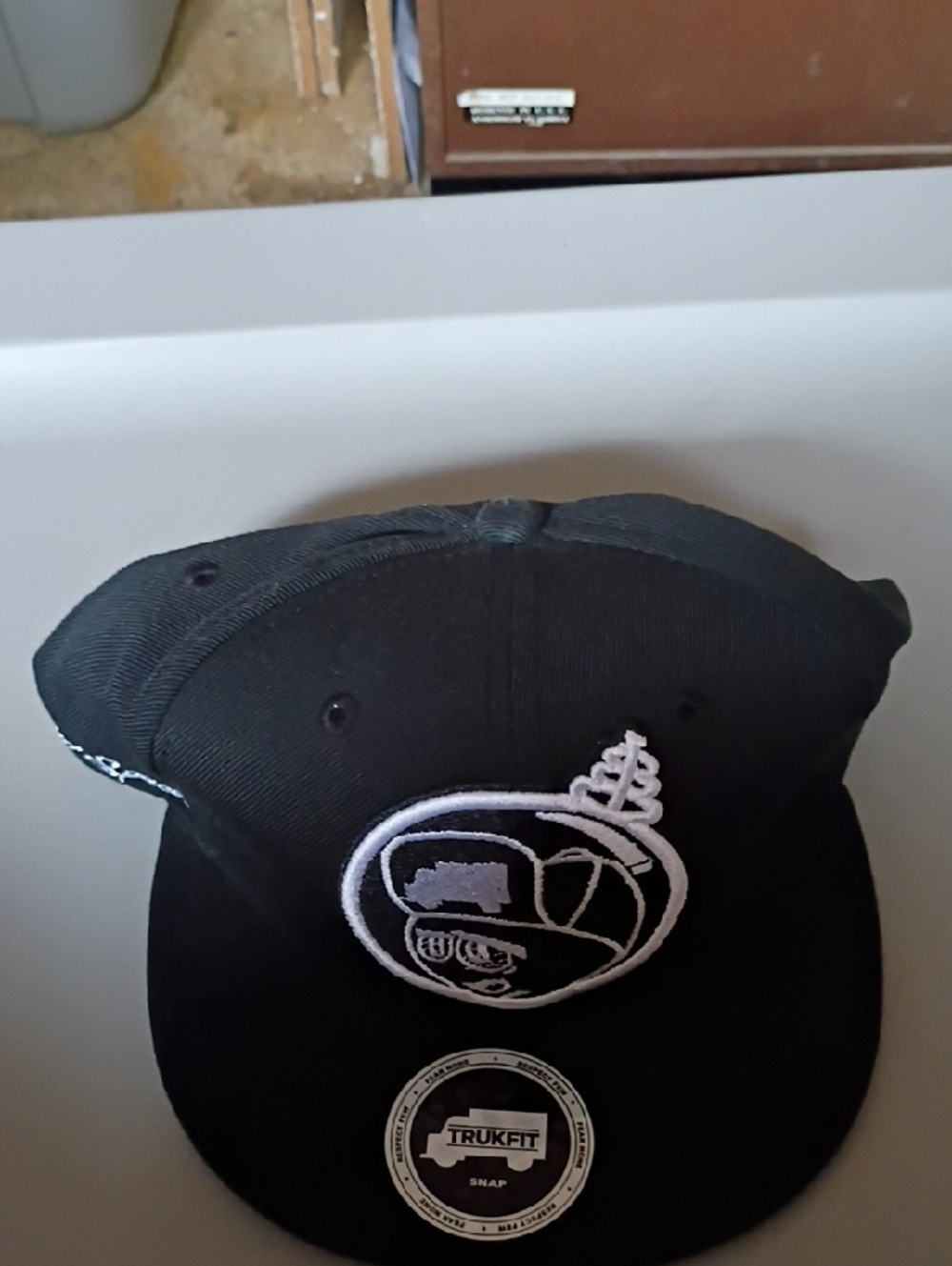 Trukfit Black Snapback Hat with White Embroidered Patch